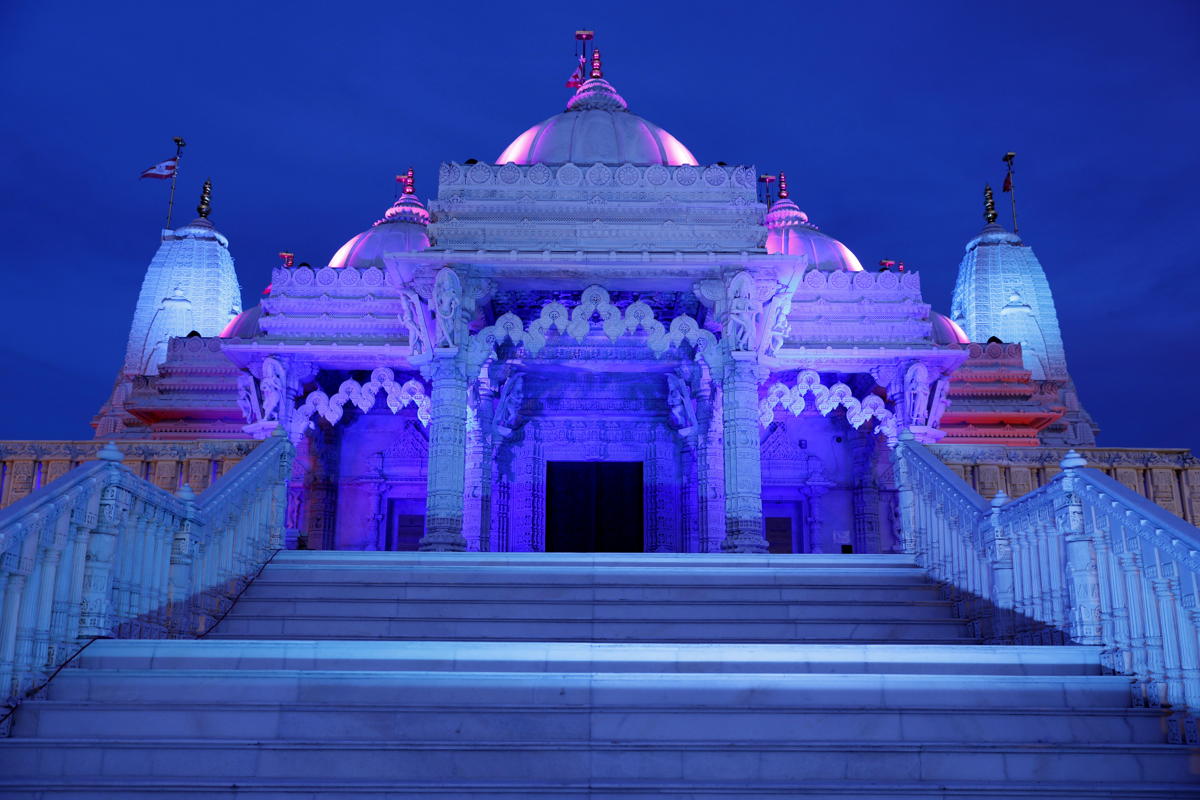 BAPS mandirs across North America lit blue to honor COVID19 first